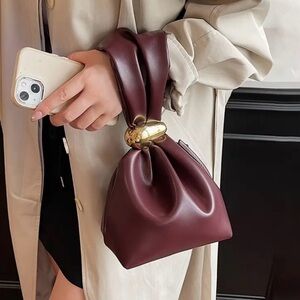 Elegant Burgundy Handbag with Gold Accent